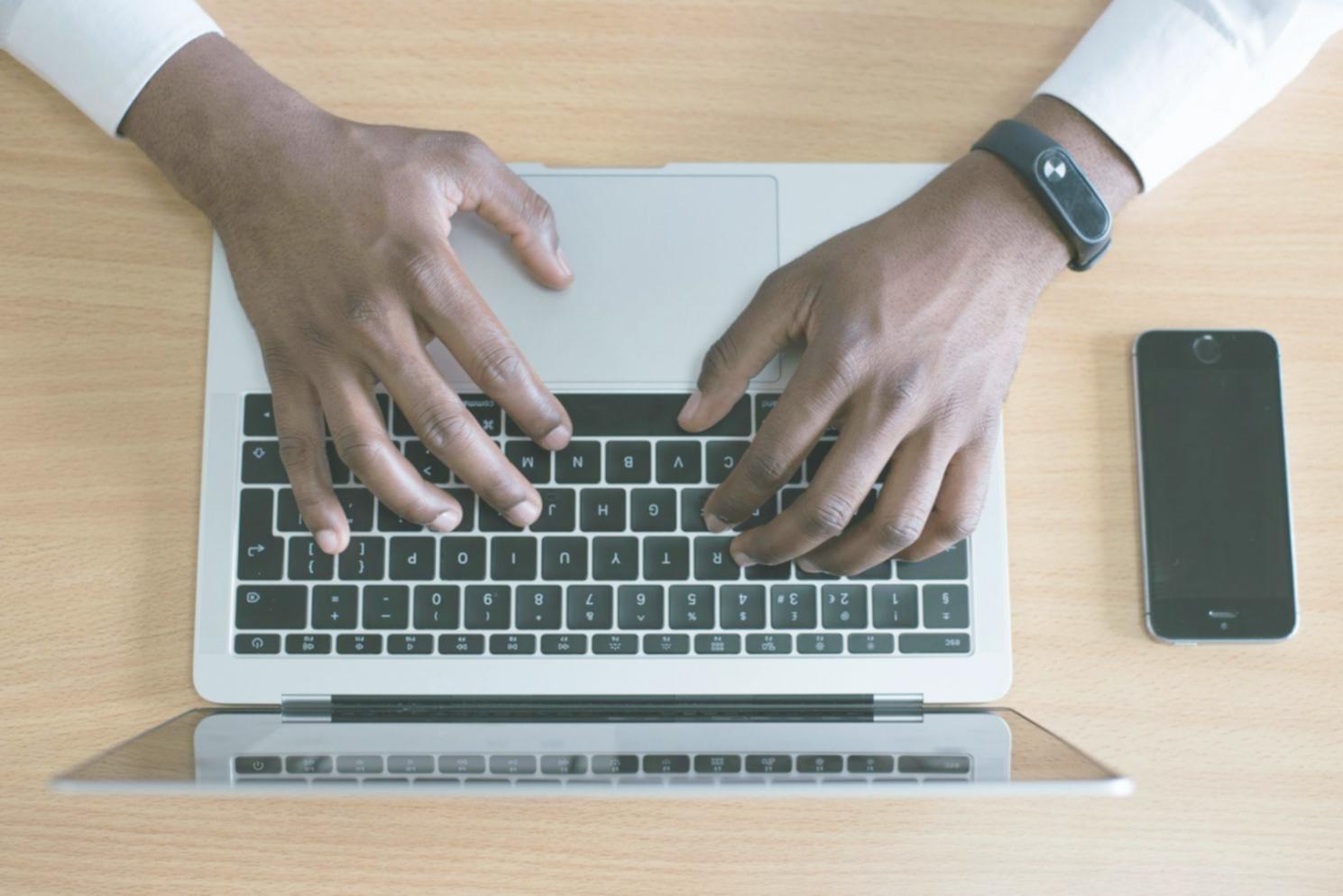 Australian business owner reviewing financial forecasts on laptop